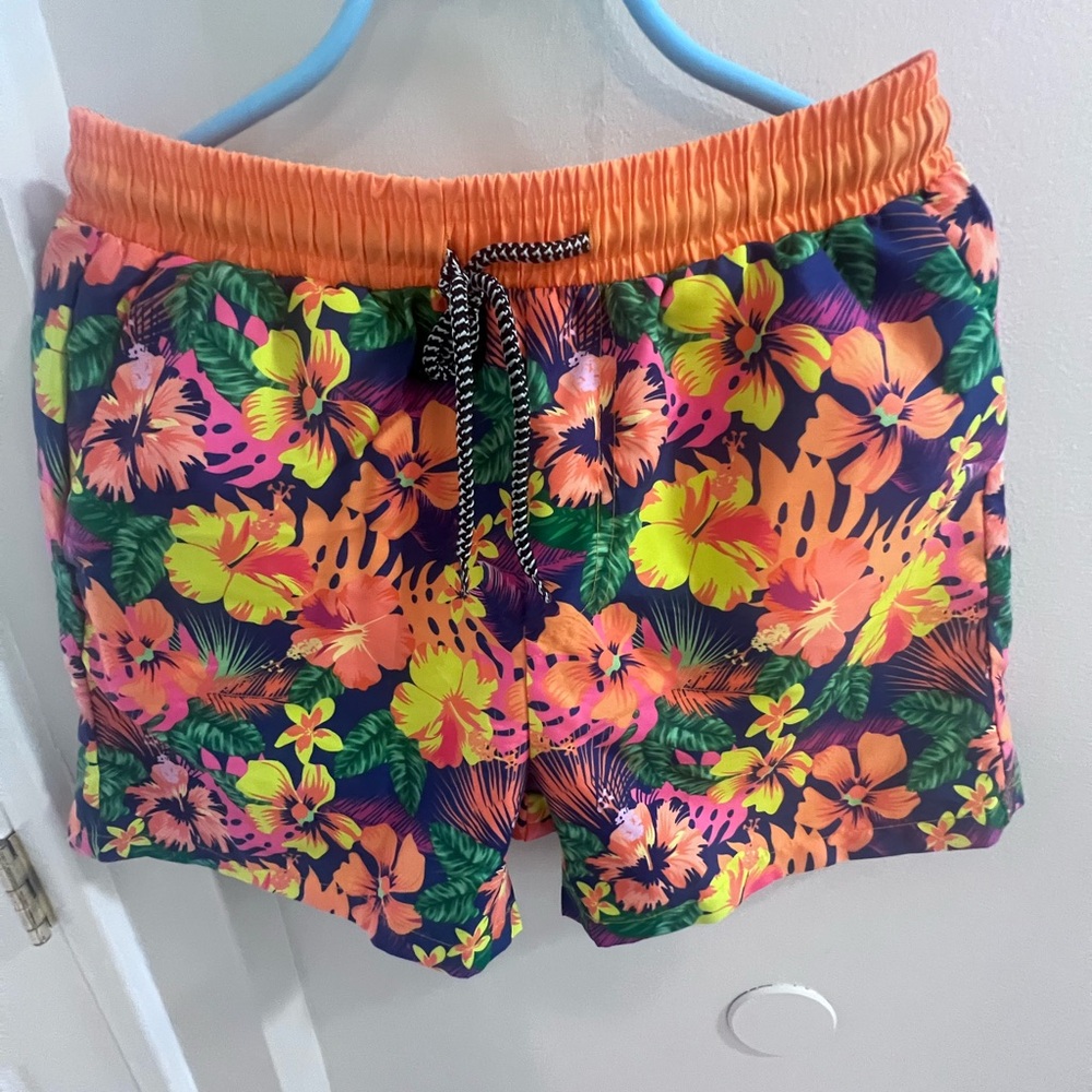 Bright orange floral print swim trunks